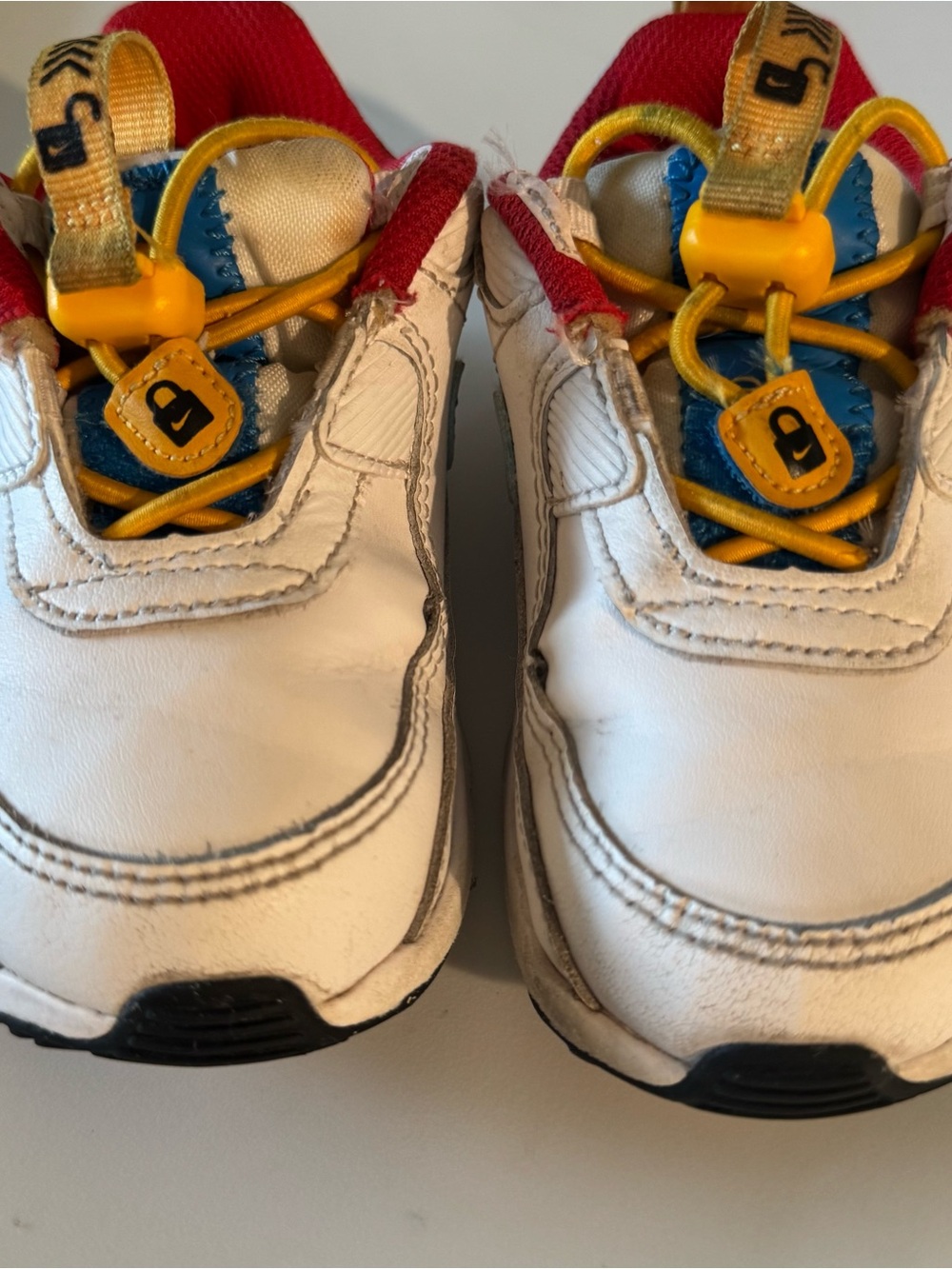 Nike Kids White Sneakers with Yellow & Red Accents